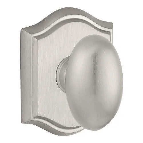 Ellipse Passage Door Knob with Traditional Arch Rose Baldwin Finish: Polished Chrome