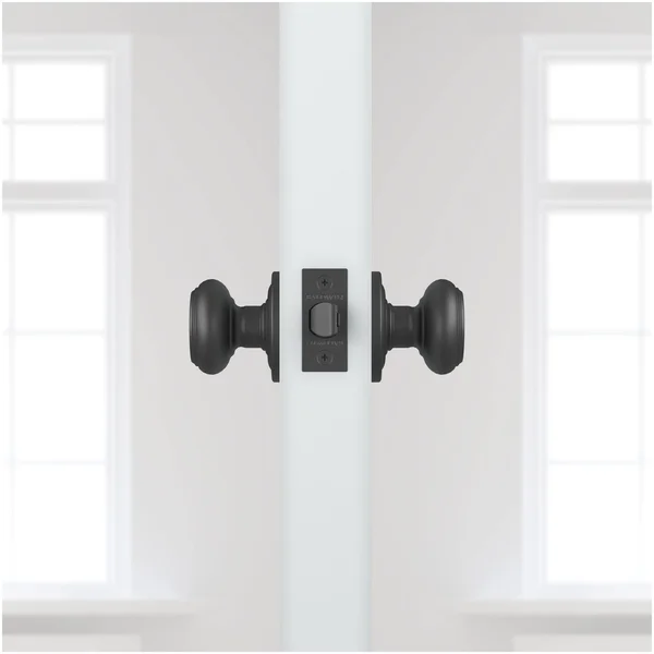 Traditional Passage Door Knob with Traditional Round Rose Baldwin Finish: Venetian Bronze