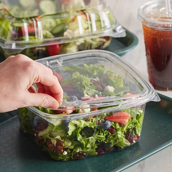 Dart CH64DEF 64 oz Tamper-Resistant Clear Hinged Container with Flat Lid (Case of 200)